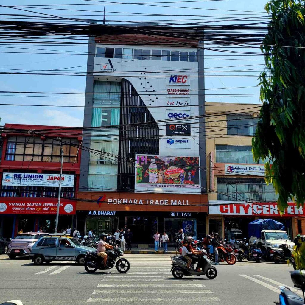 Full street-view exterior of Pokhara Trade Mall in Chipledhunga, Pokhara