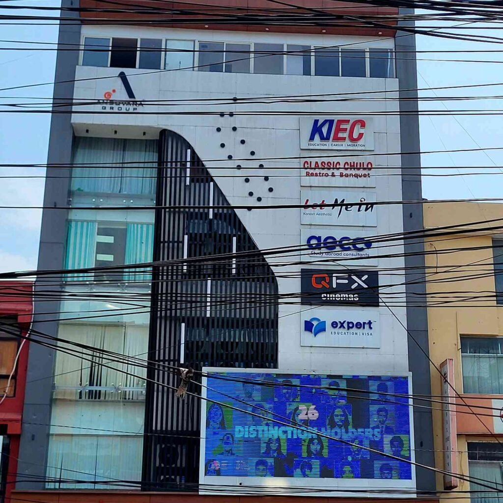 Close-up of the modern glass facade of Pokhara Trade Mall