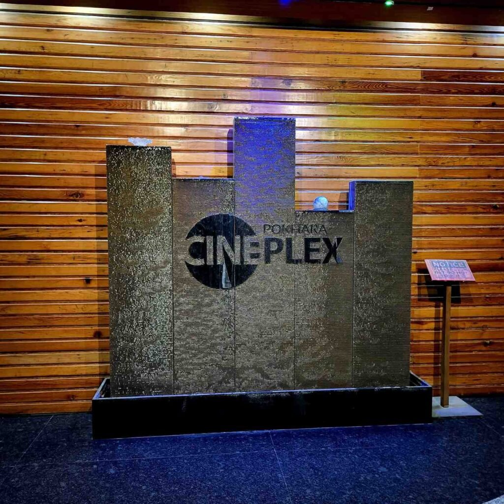 Decorative wooden indoor waterfall features and stone design inside Pokhara Trade Mall