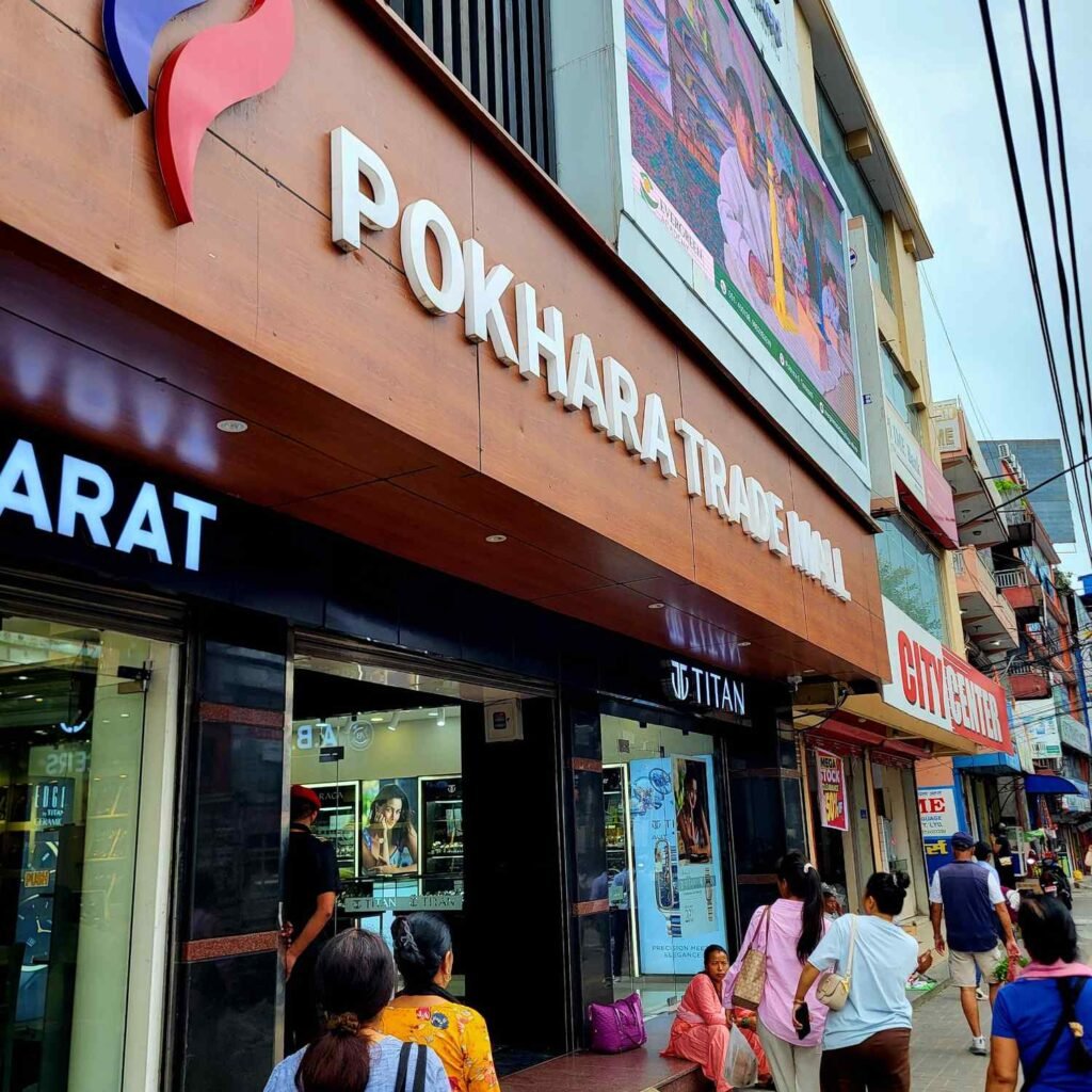 Street level view of shops and shoppers outside Pokhara Trade Mall
